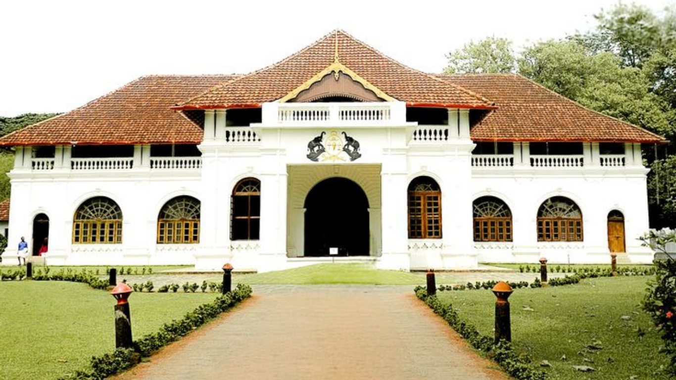 Traditional Kerala heritage palace with tiled roof and colonial architecture