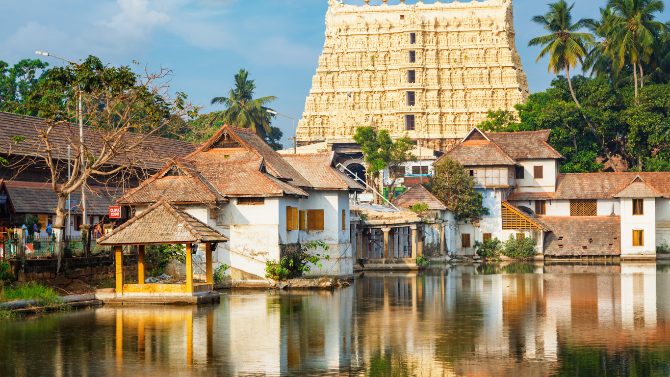 South Indian temple tank with traditional gopuram and reflections in water