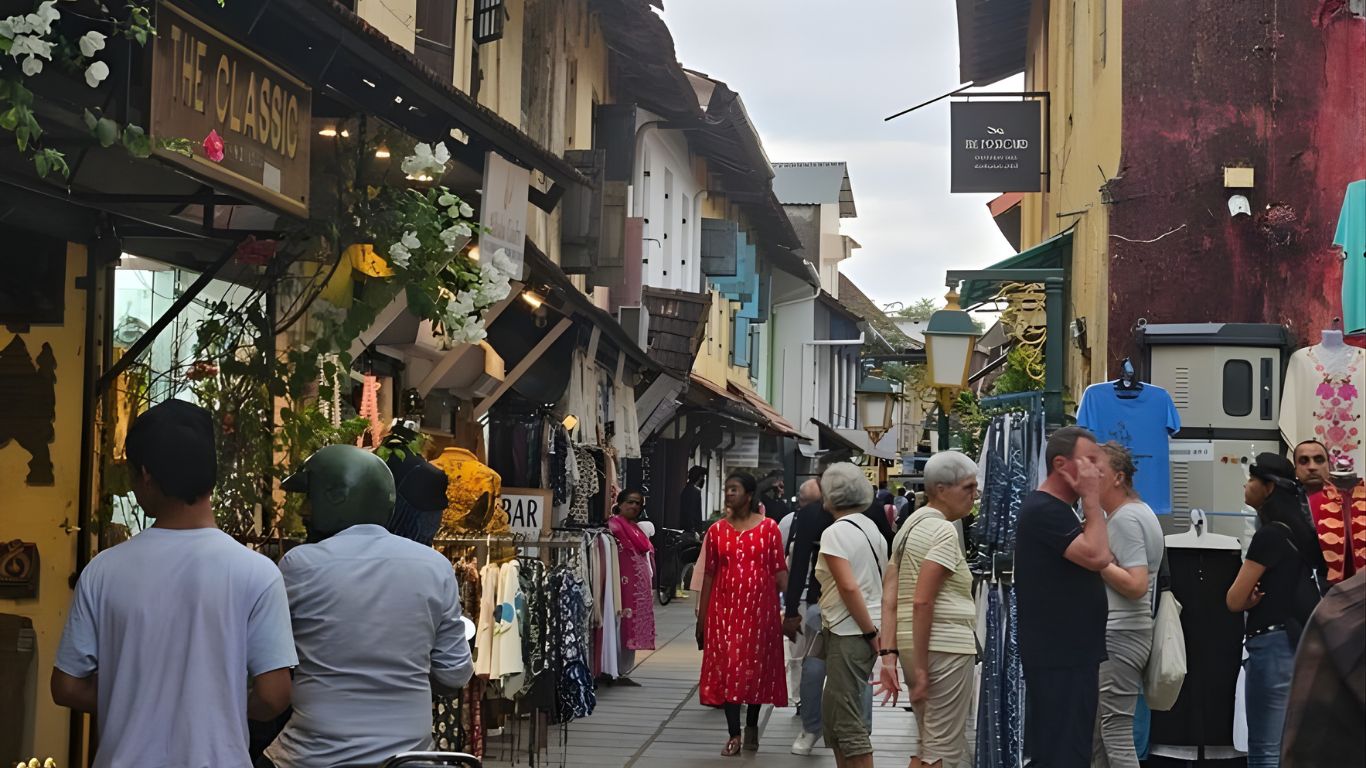 Tourists walking through a heritage market street in Kerala