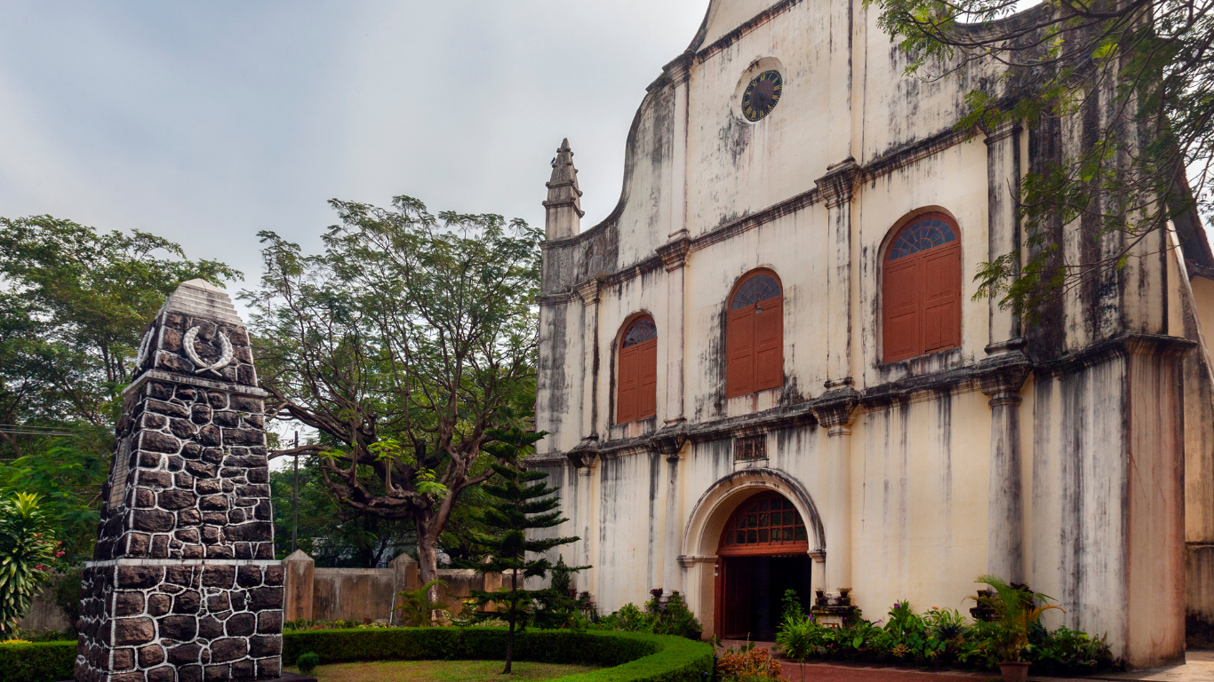 Historic colonial church in Kerala with arched entrance