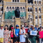 Mumbai Shore Excursions Guide Tour group photo in front of Chhatrapati Shivaji Maharaj Terminus during a guided Mumbai sightseeing tour