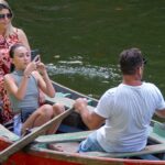 Tourists enjoying a traditional country boat ride through Kumbalangi backwaters near Kochi