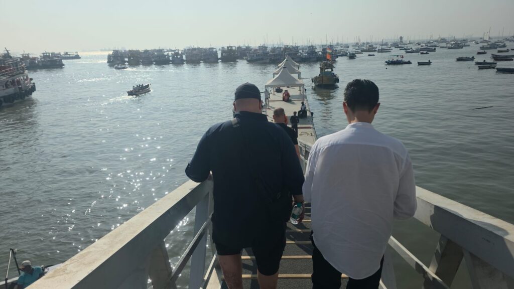 Travelers boarding a boat during a luxury Elephanta Caves private speedboat tour from Gateway of India Mumbai